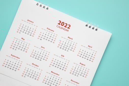 2022 calendar page on blue background business planning appointment meeting concept photo