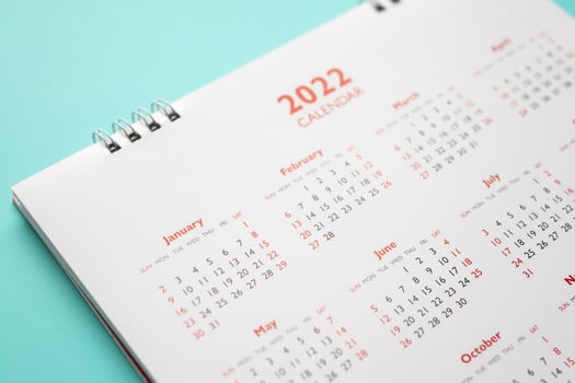 2022 calendar page on blue background business planning appointment meeting concept photo