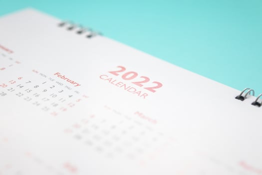 2022 calendar page on blue background business planning appointment meeting concept photo