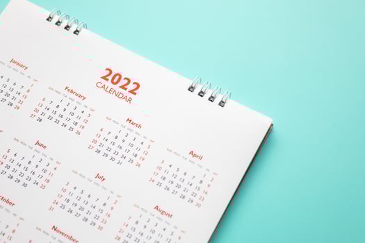 2022 calendar page on blue background business planning appointment meeting concept photo