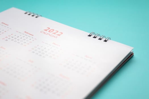 2022 calendar page on blue background business planning appointment meeting concept photo