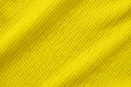 Yellow color football jersey clothing fabric texture sports wear background, close up photo