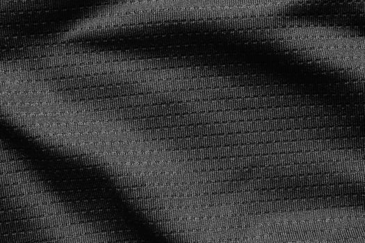 Black sport cloth fabric football shirt jersey texture close up photo