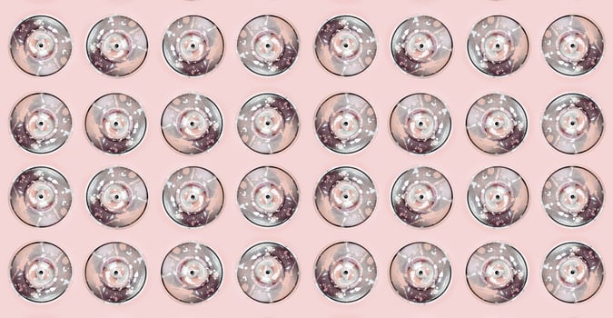 Many used spray cans for graffiti drawing lies on a pastel colored backgroung. Street art painting concept. Minimal flat lay pattern. Top view photo