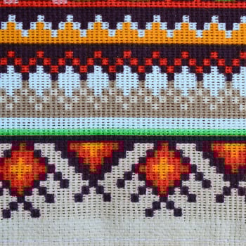 Traditional Ukrainian folk art knitted embroidery pattern on textile fabric photo
