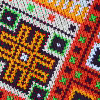 Traditional Ukrainian folk art knitted embroidery pattern on textile fabric photo