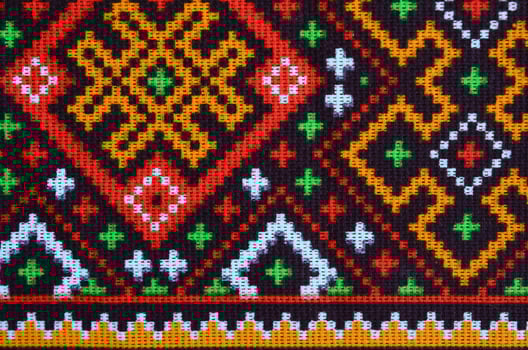 Traditional Ukrainian folk art knitted embroidery pattern on textile fabric photo
