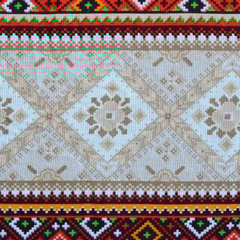 Traditional Ukrainian folk art knitted embroidery pattern on textile fabric photo