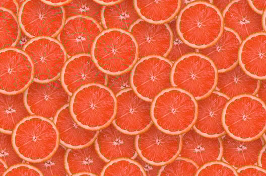 Pattern of red grapefruit citrus slices. Citrus flat lay photo