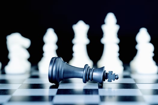 Closeup chess pieces on chessboard photo