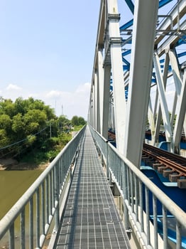The pedestrian bridge beside the railway bridge photo