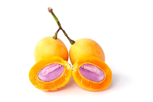 Cut half and whole ripe Marian Plum or Plum Mango Thai people call Ma Prang isolated on white background. photo