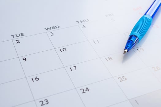 Blue pen on calendar page background business planning appointment meeting concept photo