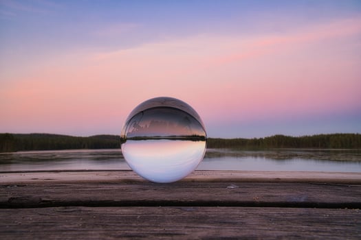Glass ball on a wooden pier at a Swedish lake at evening hour. Nature Scandinavia photo