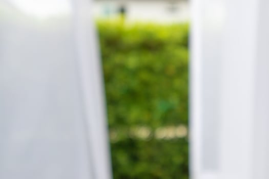 Abstract blur curtain window with green garden background photo