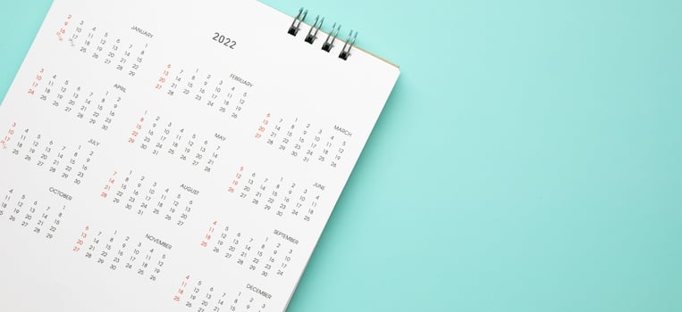 2022 calendar page on blue background business planning appointment meeting concept photo
