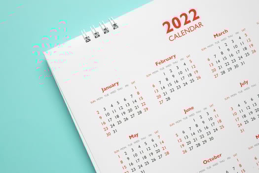 2022 calendar page on blue background business planning appointment meeting concept photo