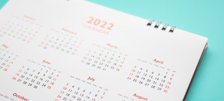 2022 calendar page on blue background business planning appointment meeting concept photo