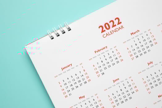 2022 calendar page on blue background business planning appointment meeting concept photo