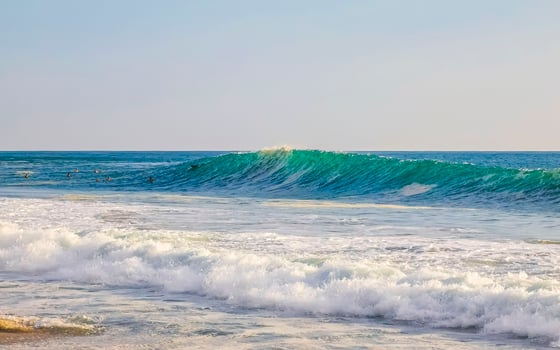 Extremely huge big surfer waves at beach Puerto Escondido Mexico. photo