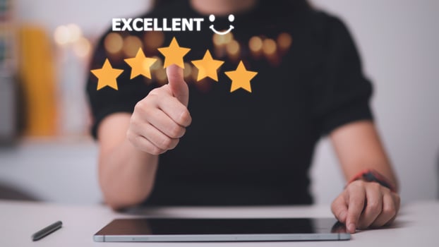 customer hand  with gold five star rating feedback icon and press level excellent rank for giving best score point to review the service, business concept photo
