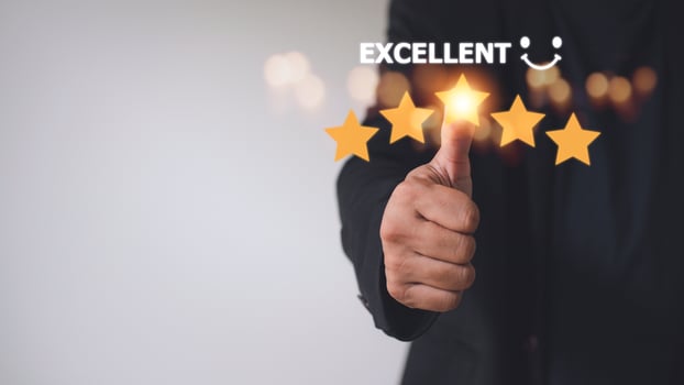 customer hand  with gold five star rating feedback icon and press level excellent rank for giving best score point to review the service, business concept photo