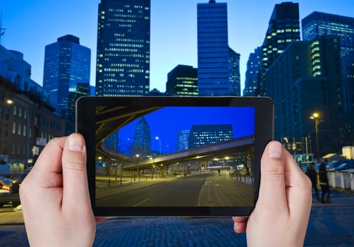 tourist taking photo of New York City in night