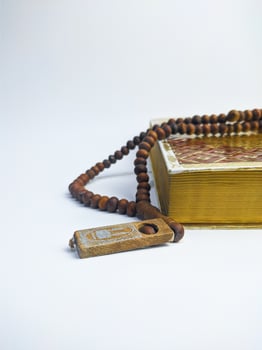 Islamic concept - The Holy Al Quran, on white background, with copy space photo