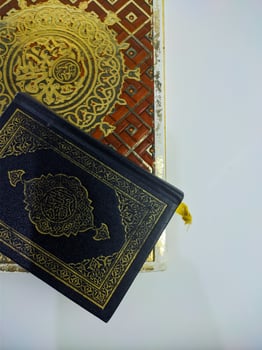 Islamic concept - The Holy Al Quran, on white background, with copy space photo