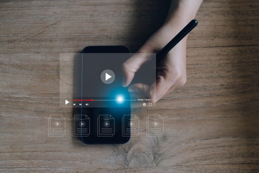 man using mouse and keyboard for streaming online, watching video on internet, live concert, show or tutorial photo