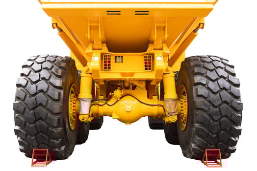 Mining, mining dump truck of yellow color on a white isolated background. Back view. photo