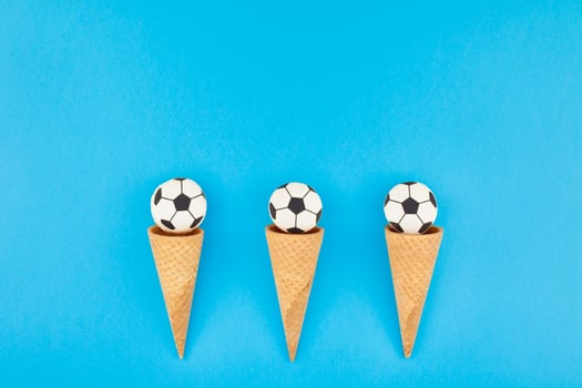 Football macaroons in waffle cones photo