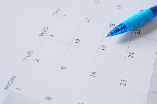 Blue pen on calendar page background business planning appointment meeting concept photo