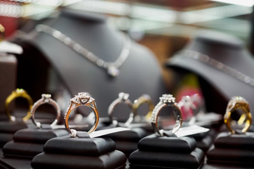 Jewelry diamond rings and necklaces show in luxury retail store window display photo