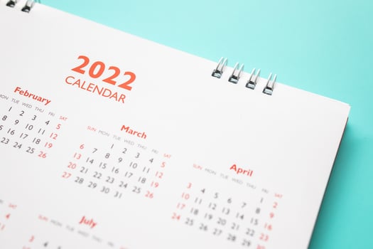 2022 calendar page on blue background business planning appointment meeting concept photo