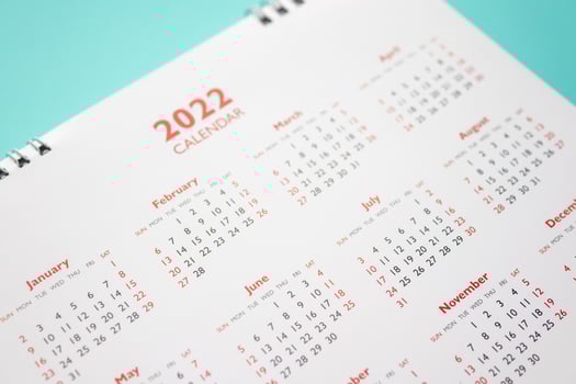 2022 calendar page on blue background business planning appointment meeting concept photo
