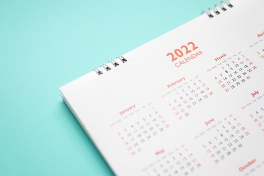 2022 calendar page on blue background business planning appointment meeting concept photo