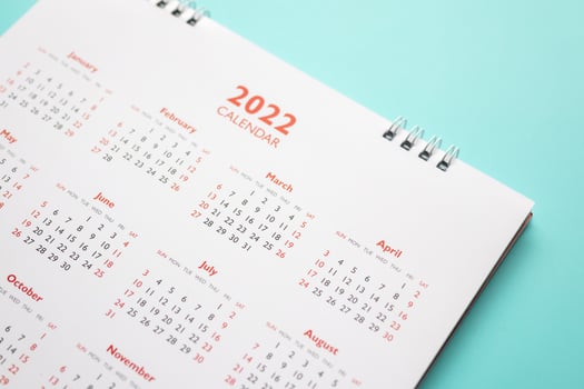 2022 calendar page on blue background business planning appointment meeting concept photo
