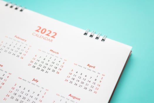 2022 calendar page on blue background business planning appointment meeting concept photo