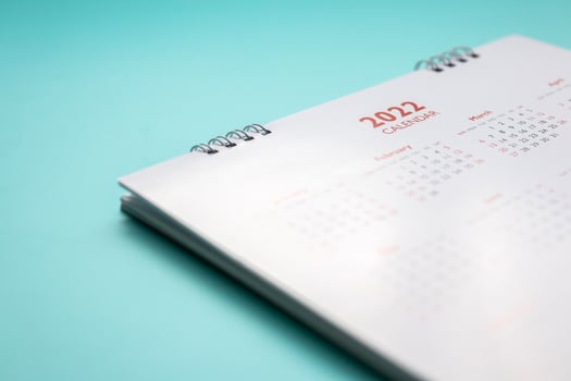 2022 calendar page on blue background business planning appointment meeting concept photo