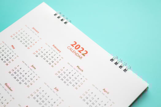 2022 calendar page on blue background business planning appointment meeting concept photo