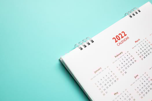 2022 calendar page on blue background business planning appointment meeting concept photo