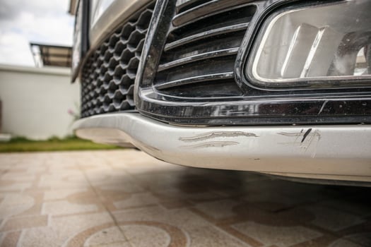 car bumper scratched paint damage photo