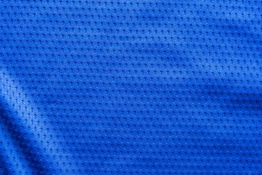 Blue color fabric sport clothing football jersey with air mesh texture background photo