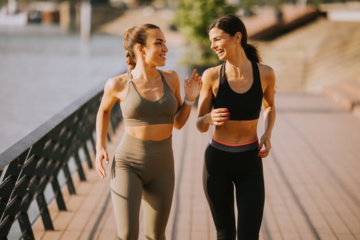 Young woman taking running exercise by the river promenade photo