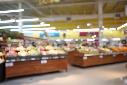 abstract blur organic fresh fruits and vegetable on grocery shelves in supermarket store defocused bokeh light background photo
