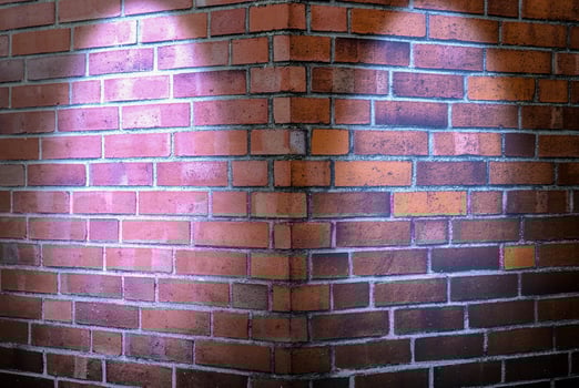 Aged and weathered brick wall textures with very bright spotlight illumination photo