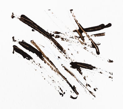 strokes of watercolor paint with stick on paper photo