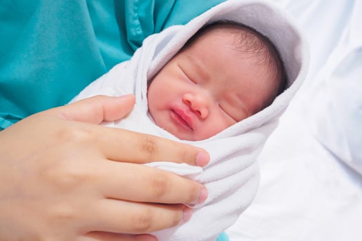 Happy Mother and Newborn Baby at the hospital photo
