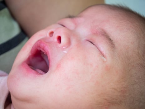 newborn baby girl crying photo